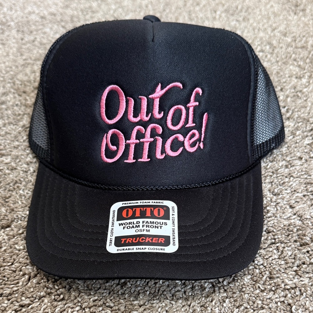 black and pink out of office trucker hat
